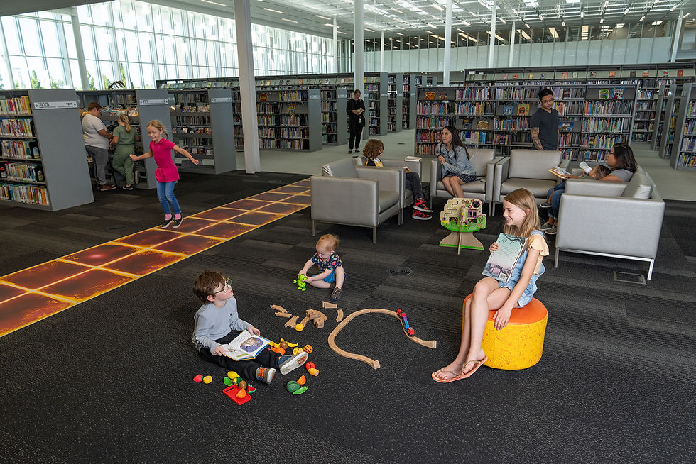 Children enjoying various toys and activities in the Weber County Library