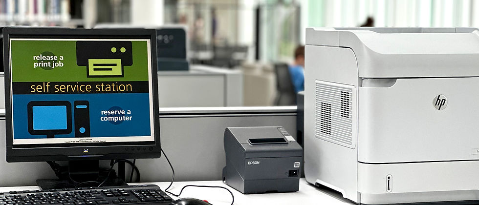 computer and printer at Weber County Library with Print Self Service Station displayed on monitor.