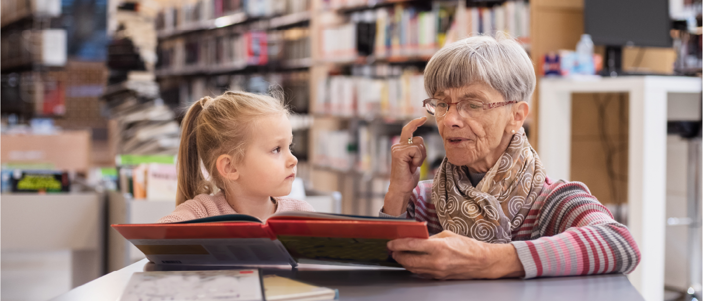 woman reading to child girl