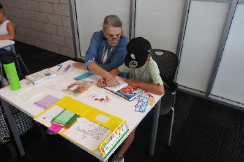 woman reading with child boy