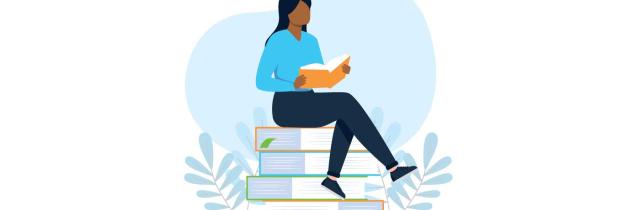 Person sitting on books reading